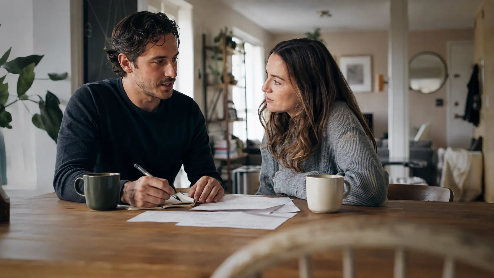 A couple calmly talking about household finances